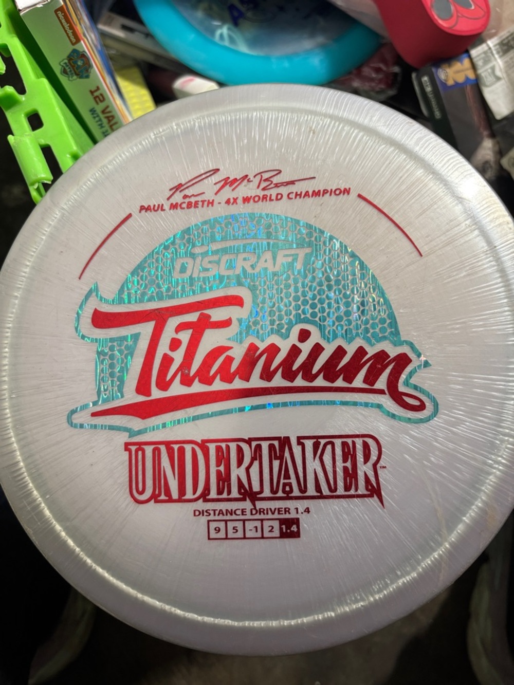 Preowned DisCraft Titanium Undertaker Disc - White with Red & Teal